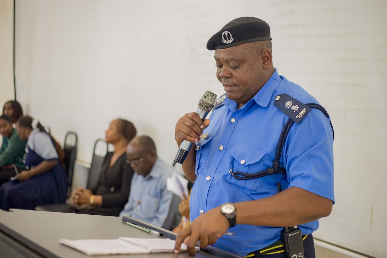 Representative from University auxilliary police addressing students